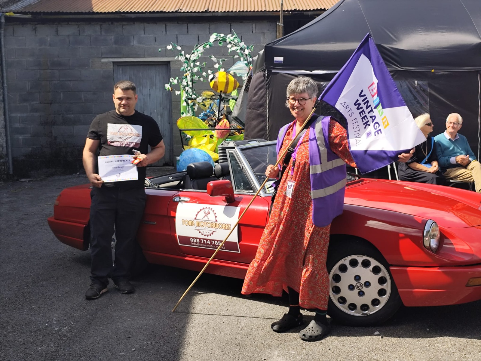 Tom with the award certificate beside the winning Alfa Romeo Spider at Birr Vintage Week